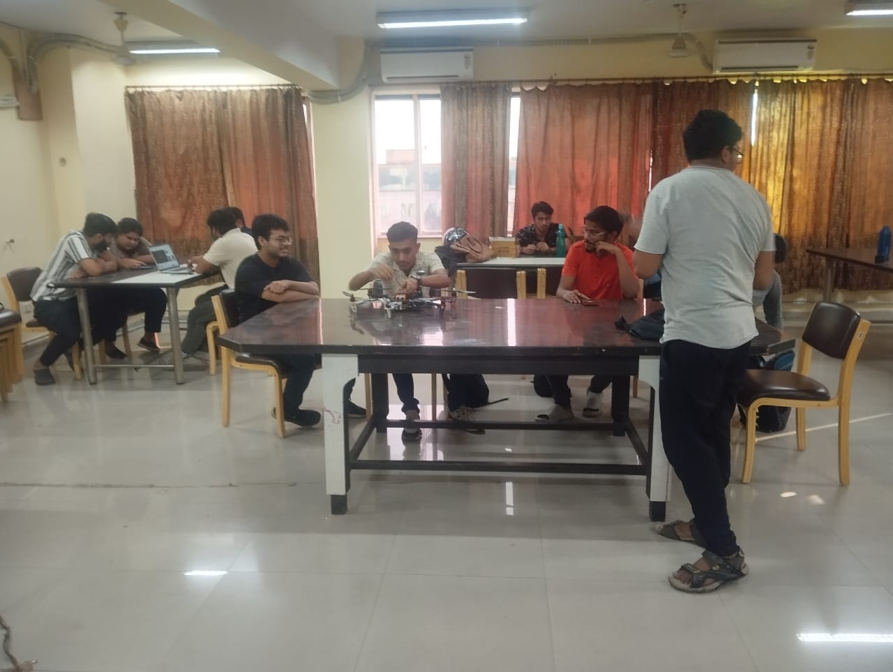 Workshop room with students collaborating